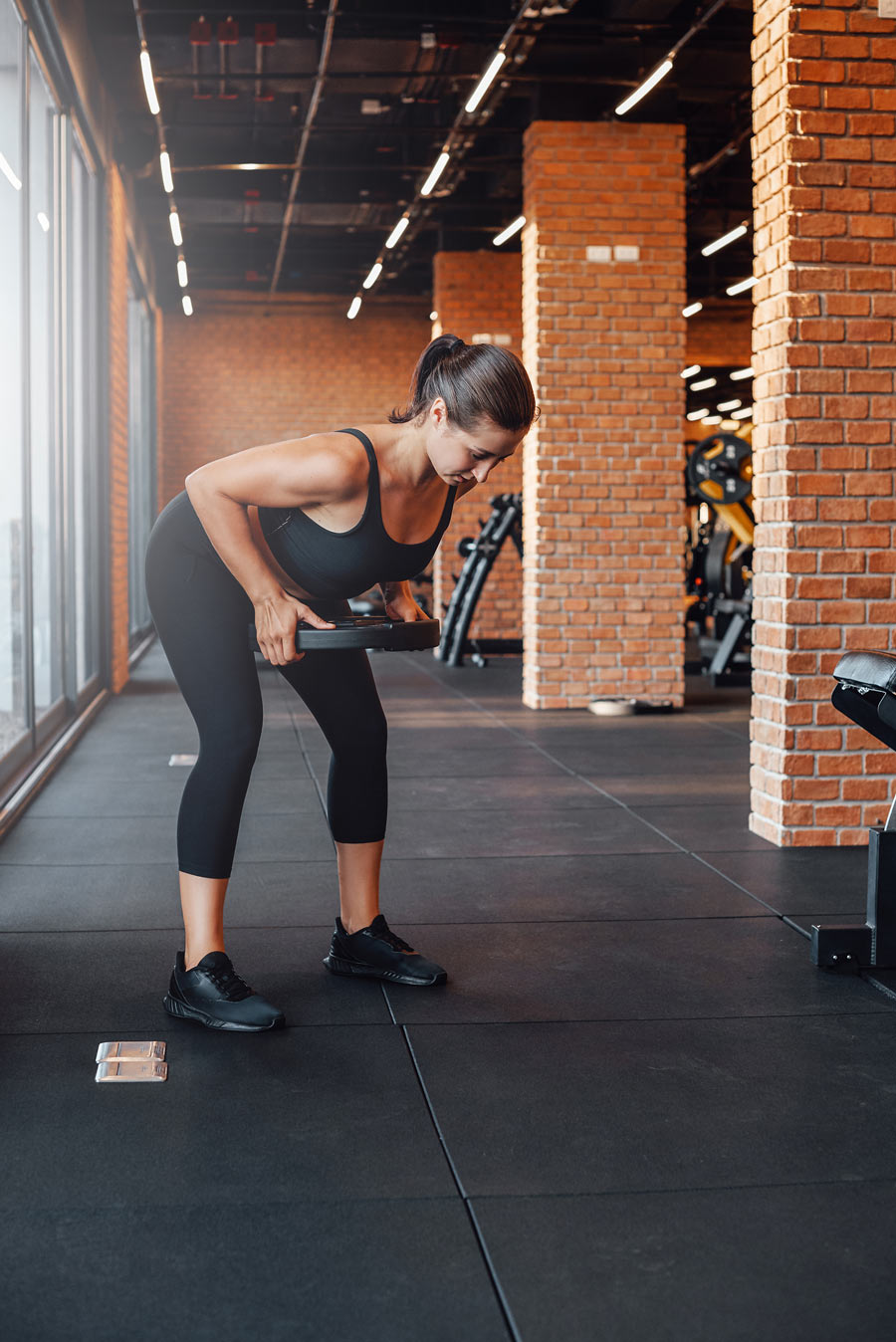 female bodybuilder trains lifting a dumbell in mod 2021 08 31 21 30 11 utc