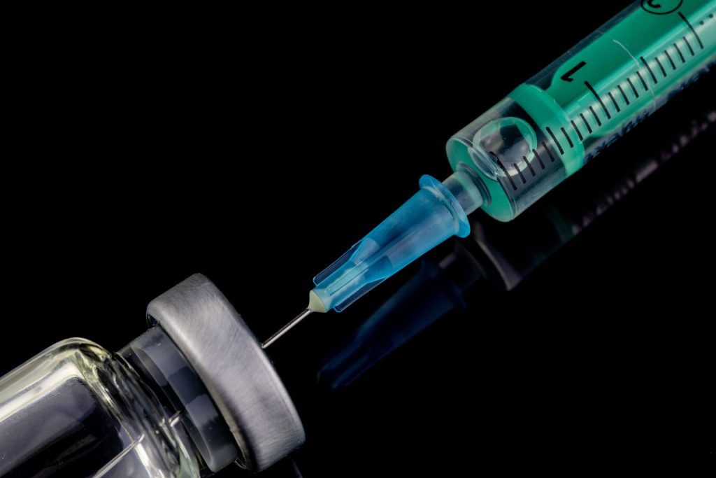 close up of glass medicine vial with syringe and n 2023 08 17 00 56 44 utc